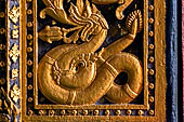 Luang Prabang, Laos - Wat Pa Phai the 'Bamboo Forest Monastery', detail of the doorways of the facade. 